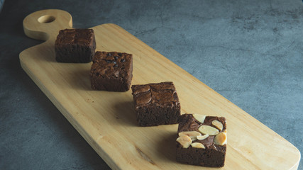 brownies cut in squares. Dark food photography concept