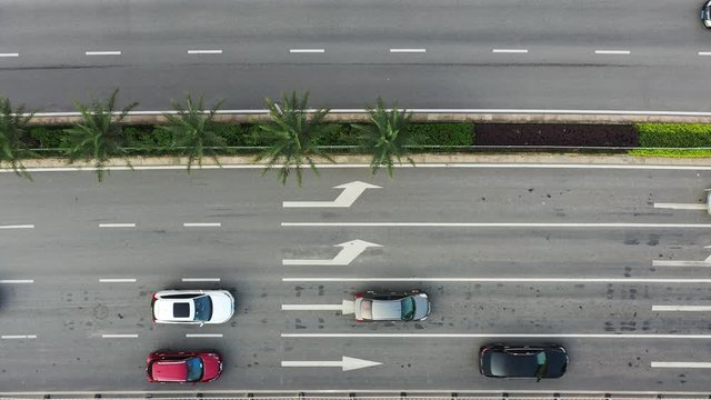 High angle top view of vehicles driving on city road