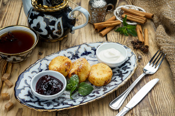 Pancakes on plate for breakfast with jam and spoon 