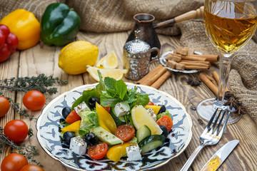 Salad from tomatoes, cucumber, red onions and lettuce leaves. healthy summer vitamin menu. vegan vegetable food. vegetarian dinner table. top view. flat lay