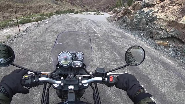 A thrilling clip of slow driving on extremely dangerous mountain mud road during rain. Shot in barren mountains region of Ladakh, close to China Tibet border using an action cam.