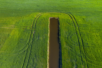 Land improvement or land amelioration concept, drone flying over narrow irrigation or drainage...