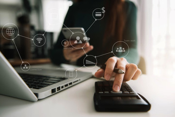 Hand women doing finances and calculate on desk about cost at home office.