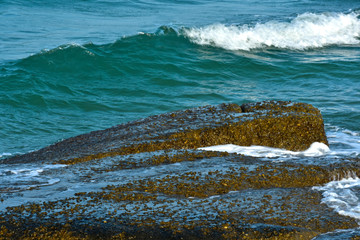 Blue sea That is a wave, because the strong wind causes the beautiful water to rise