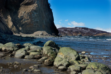 Fototapeta premium Wild beach made of volcanic sand on the Pacific Ocean, Kamchatka Peninsula, Russia.
