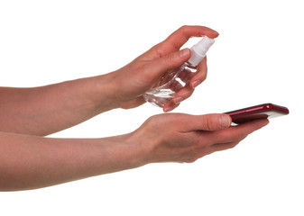 Smartphone cleaning with special anti bacterial spray. Antiseptic treatment during coronavirus quarantine.
