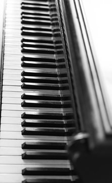 black and white photos of piano keyboard