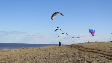 man and woman on a parachute