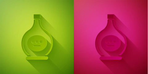 Paper cut Bottle of cognac or brandy icon isolated on green and pink background. Paper art style. Vector Illustration