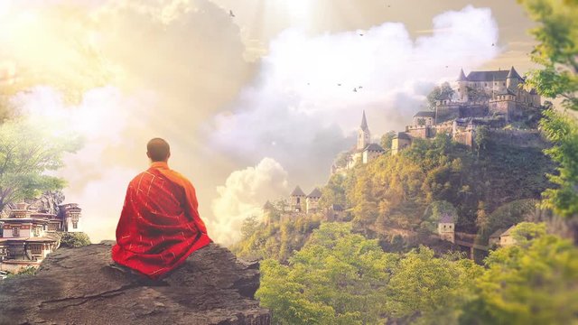 A person or monk sitting on hill/mountain and meditating in serene nature as birds and clouds fly by