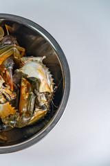 Closeup photo of uncooked crab in the bowl