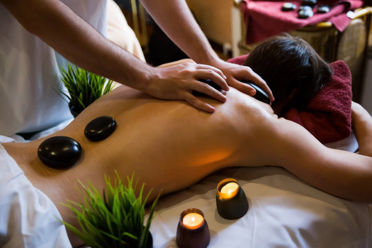 stonehenge therapy massage man close-up back large paln massage therapist
