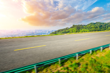 Fototapeta premium Motion blurred highway and city skyline in hangzhou.