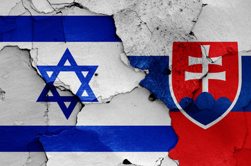 flags of Israel and Slovakia painted on cracked wall