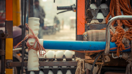 Blue tyre pump laying horizontally with plastic rope