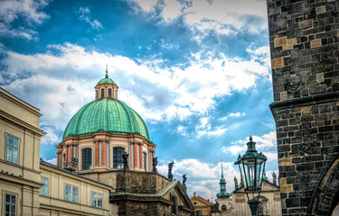 Dome of the old church in Prague against a cloudy stormy sky. The power of religion