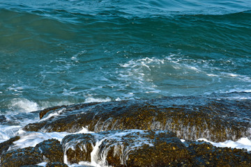 Blue sea That is a wave, because the strong wind causes the beautiful water to rise
