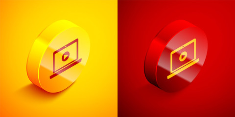 Isometric Online play video icon isolated on orange and red background. Laptop and film strip with play sign. Circle button. Vector Illustration