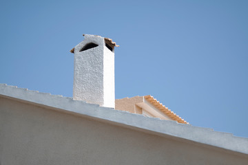 White chimney and yellow roof