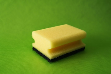 kitchen sponge on a green background
