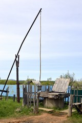 Unique old Russian well named shadoof (or shaduf) in countryside on a summer day