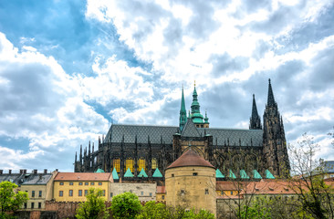 Fototapeta na wymiar Gothic spiers and lancet windows of St. Vitus Cathedral. Ancient Prague