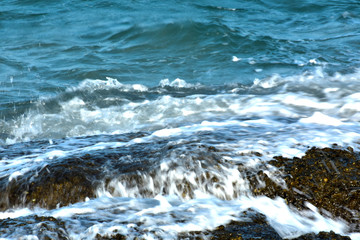 Blue sea That is a wave, because the strong wind causes the beautiful water to rise