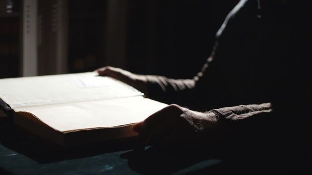 Monk is reading an old book