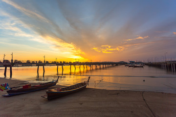 Obraz premium sunrise at Chalong pier. Chalong bay is the most important marina of Phuket there have 2 piers and customs at pier..