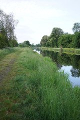 Water reflection of Havel river canal Voßkanal in Krewelin, Oberhavel, Ruppiner Lakeland, Brandenburg, Germany, section of famous Berlin-Copenhagen Cycle Route                           