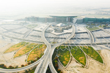Aerial view of the Meydan racecourse complex during sunrise. Dubai, UAE.