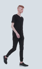 in full growth. modern guy student slowly goes forward