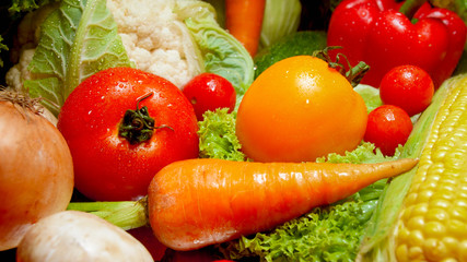 Closeup photo of wet washed vegetables from garden lying on kitchen desk. Background for healthy food and GMO free products.Diet nutrition and fresh vegetables. Vegan and vegetarian background.