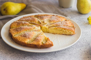 Delicious pear and almond pie. Romantic summer composition with flowers