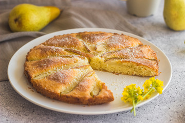 Delicious pear and almond pie. Romantic summer composition with flowers