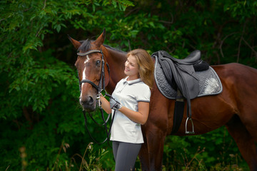 Beautiful young girl rider and her horse