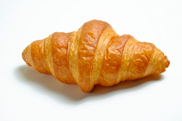 Studio shot of appealing plain mini croissant baked to golden crisp isolated on white backgroud. Traditional french pastry. Close up, copy space, top view.