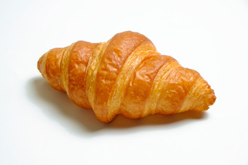 Studio shot of appealing plain mini croissant baked to golden crisp isolated on white backgroud. Traditional french pastry. Close up, copy space, top view.