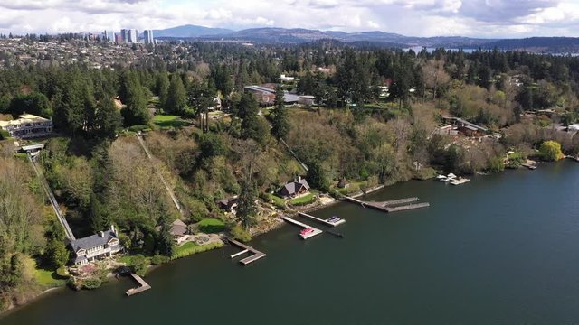 Aerial / drone footage of waterfront mansions, luxury homes and villas in Medina near Belleview and Seattle, Washington during the COVID-19 pandemic