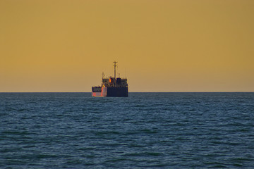Cargo ship on the Black Sea at sunset, Georgia