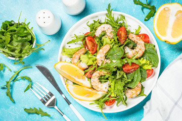 Shrimp salad with vegetables and leaves.