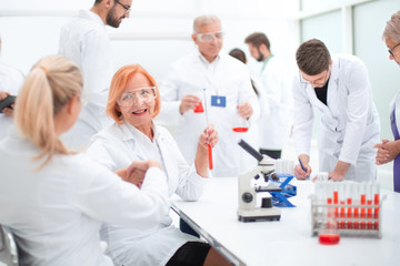 group of doctors and scientists work in the laboratory.
