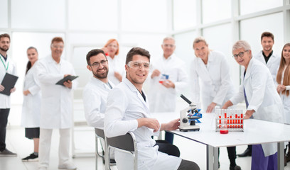 Fototapeta premium young scientist and his colleagues work in the laboratory.