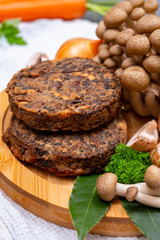 Tasty vegetarian food, burgers with champignons mushrooms, buna shimeji, carrot and onion