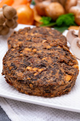 Tasty vegetarian food, burgers with champignons mushrooms, buna shimeji, carrot and onion