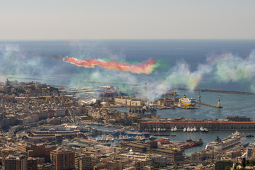 tricolor arrows cross the sky of Genoa leaving their colored trails