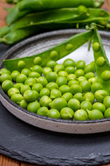 New harvest of ripe green peas legumes