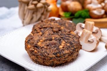 Fototapeta na wymiar Tasty vegetarian food, burgers with champignons mushrooms, buna shimeji, carrot and onion