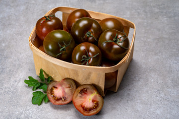 Fresh ripe sweet reddish brown and green kumato tomatoes