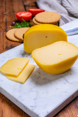Dutch baby gouda cheese in yellow wax